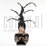 25-02-2004 Trudy Labij at studio in Amsterdam, on behalf of poster -La Bij, Ik voel mij goed-, by order of impresariaat Jacques Senf, February 25, 2004 

[keywords]Posed, Eyecontact, Headgear[/keywords]